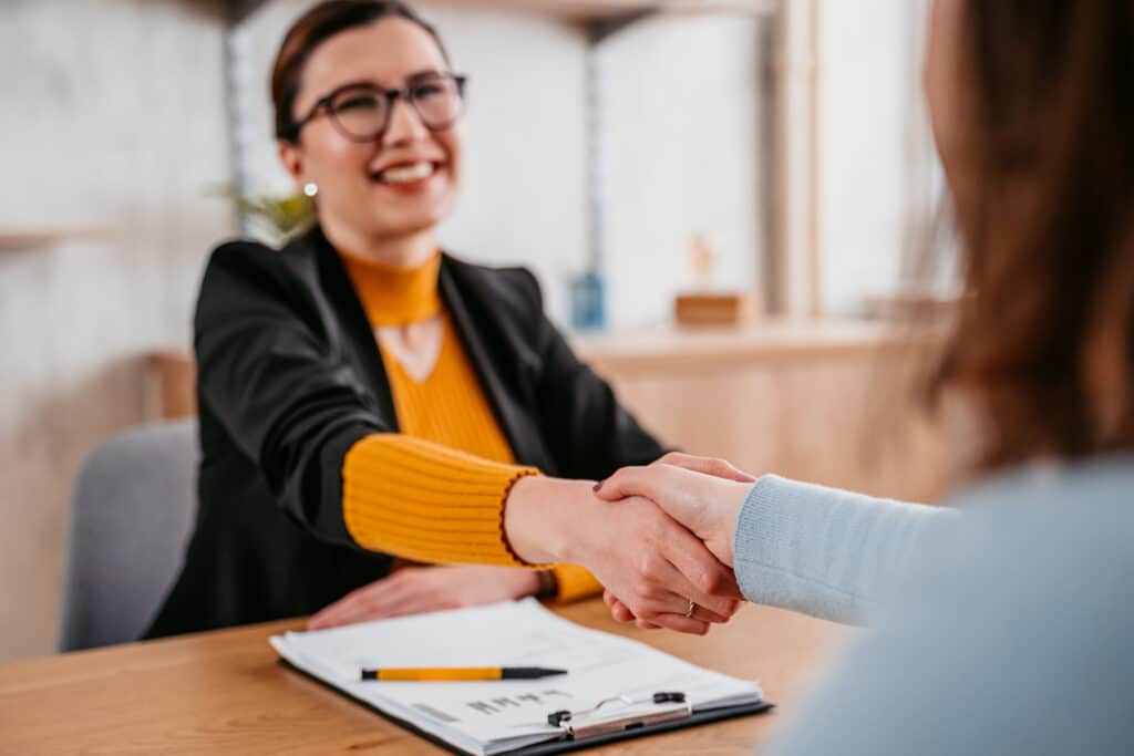 Young Woman Meeting With A Real Estate Agent