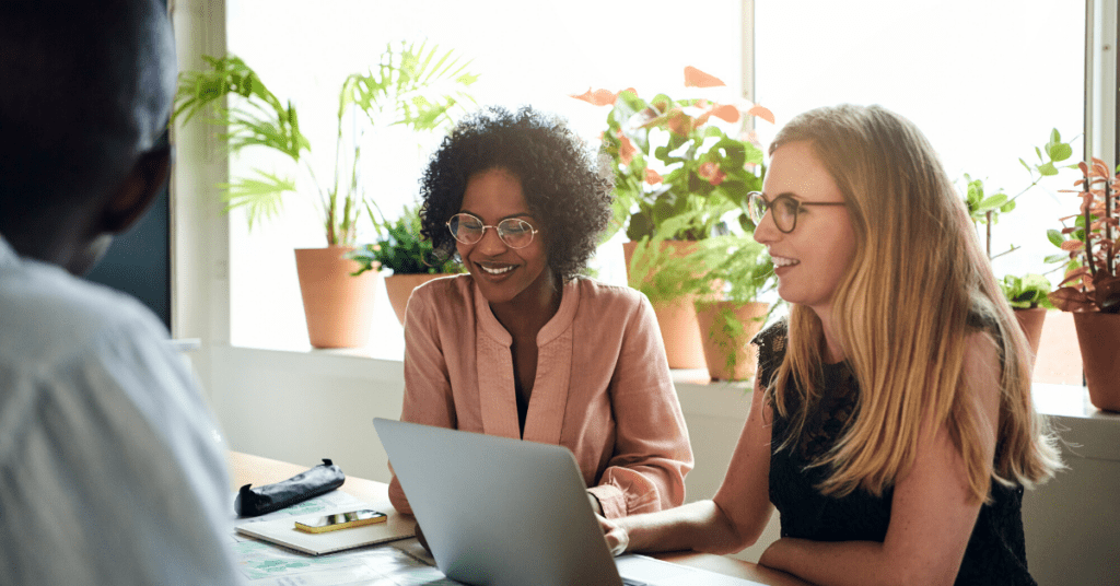 Two employees discuss where to relaunch customer community