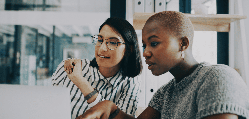 women discussing in the office